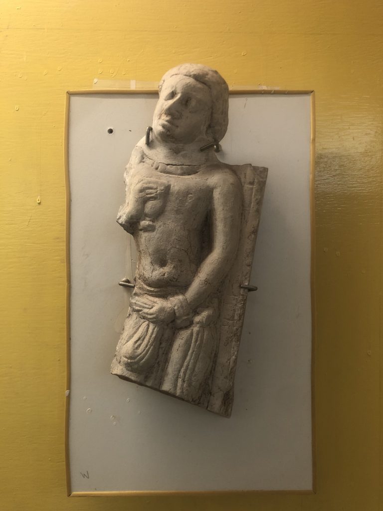 Male figure found from the site displayed at the Centenary Heritage Museum